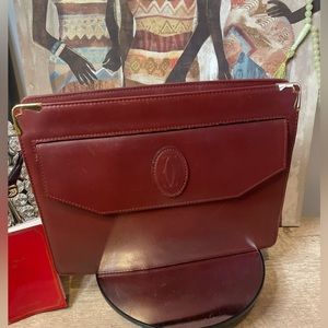 Cartier Must De Cartier oxblood leather clutch bag